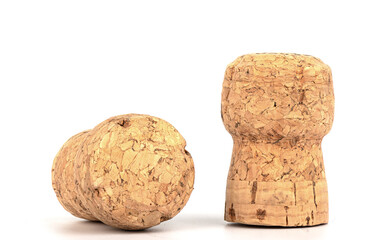 Two corks of champagne over a white background.