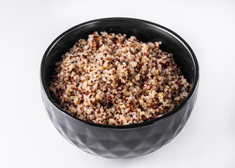bowl of healthy quinoa on a white acrylic background