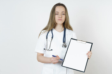 Medicine and health concept. Doctor pointing with a pen to a tablet. Looking at the camera.