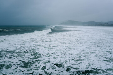 Long waves in the ocean near the coast during a storm
