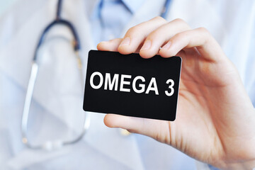 doctor holding a paper card with text Omega 3, medical concept