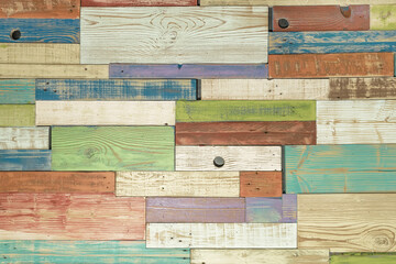 Horizontal painted multicolored wooden planks of wall in different colors. Surface texture, for background