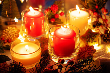 Winter Christmas holidays background with candles; christmas light; Cup of cocoa with marshmallow or hot chocolate near a window