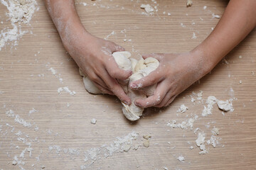 Fototapeta premium Kid you are playing and making dough.