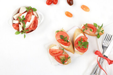 Caprese Bruschetta toast with mozzarella cheese, cherry tomatoes and fresh garden Basil.Traditional Italian food, healthy natural Breakfast, cholesterol-free and GMO-free, space for text,