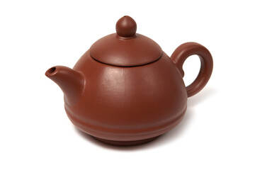 Old purple yixing clay Chinese teapot yuan zhu hu type for tea ceremony isolated on white