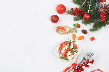 Caprese and toast with mozzarella cheese, cherry tomatoes and fresh garden Basil, Christmas and new year's food.Traditional Italian food, healthy natural Breakfast, cholesterol-free and GMO-free
