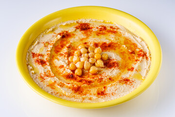 traditional turkish hummus on a white acrylic background