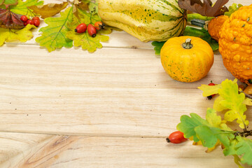 Autumn flat lay. Natural harvest with wheat grain ear orange pumpkin, fall dried leaves, red...