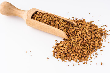instant coffee granules on a white acrylic background