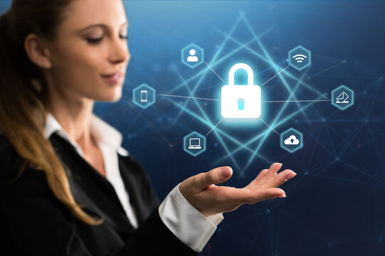 businesswoman with digital interface showing devices around a lock symbol on abstract background