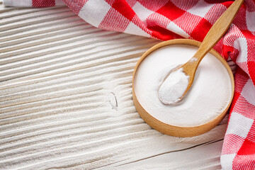 baking soda powder on wooden rustic background background