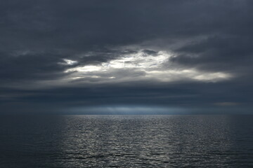 Sunlight breaks through dense clouds.