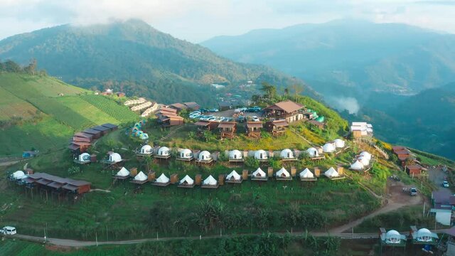 Aerial view of camping grounds and tents on Doi Mon Cham mountain in Mae Rim, Chiang Mai province, Thailand