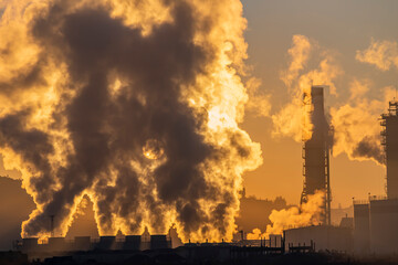 Factory smoke chimney piping smoke or steam into the air pollution