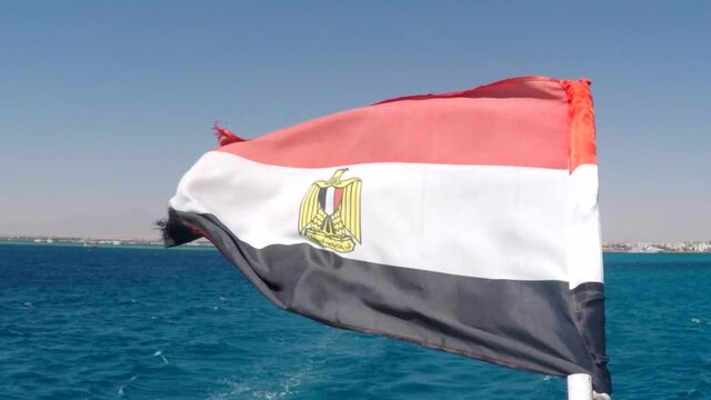 Flag Of The Country Of Egypt From A Yacht At Sea With Waves Slowmotion
