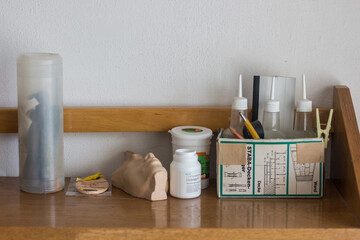 work containers and bottles on the shelf