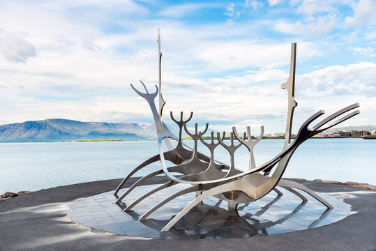 Reykjavik, Iceland - June 28, 2020: Sun Voyager monument with the bay and mountains in background