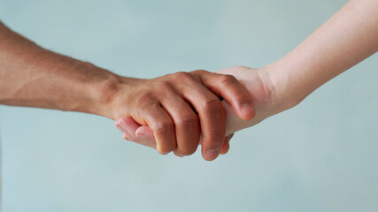 Fototapeta premium White and black hand connect. Anti-racism. Stop racism, all people are equal. Friendship of Peoples. Black lives matter