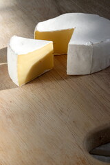 Brie cheese on wooden board