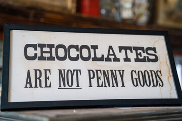 Chocolates are not penny goods sign, warning penny candy shop customers of policies