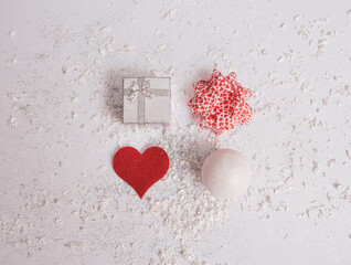 Christmas or Valentine pattern made with various objects on bright snow-white background. Minimal celebration concept. Flat lay.