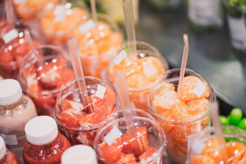 Grapefruit and tangerines in cups