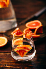 Detox water with blood oranges in drinking glass