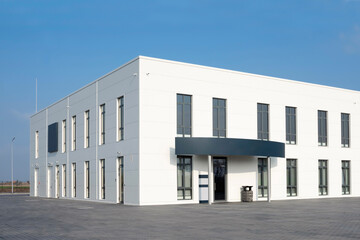 White office building against the blue sky. Service center