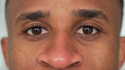 Fototapeta premium Close-up of a black man's eyes. Eyes of a thoughtful man