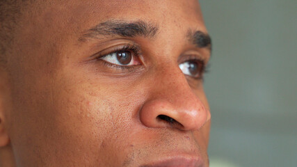 Obraz premium Close-up of a black man's eyes. Eyes of a thoughtful man