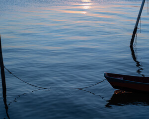 Boat silhouette with a sunset in the background