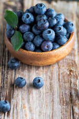 blueberries in  wooden plate