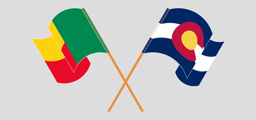 Crossed and waving flags of Benin and The State of Colorado