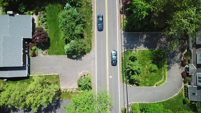 Bird's Eye View of Moving Cars on a Suburban Country Road