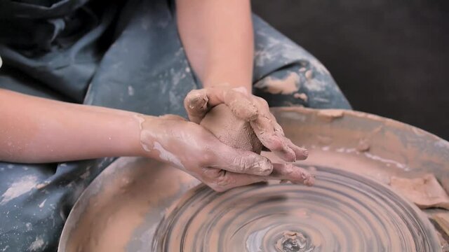 Potter master woman sculpts from clay. Ceramics art concept. Close-up.