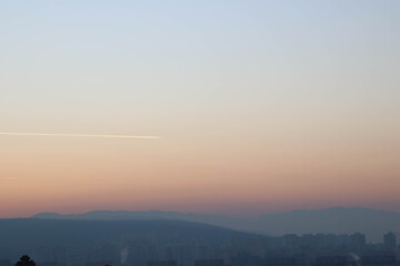 Fototapeta na wymiar Sunset time over a city landscape