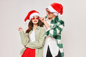 Man and woman in Christmas hats Christmas fun celebration together