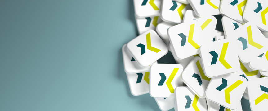 Logos of the business social media site and app Xing on a heap. Web banner size with copy space - Selective focus