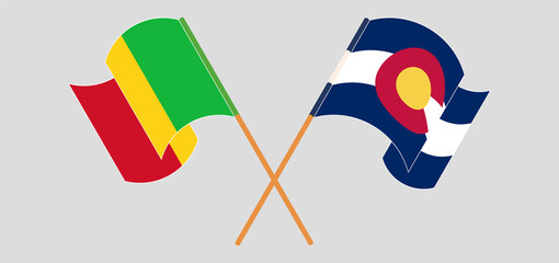 Crossed and waving flags of Mali and The State of Colorado