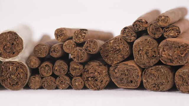 cigarillo and cigars in black background 4k