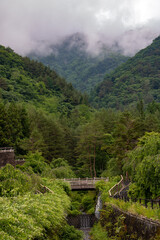 A clouds cover the tops of the hills around Saiko lake, Japan.