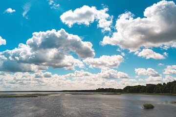 Clouds above the river on sunny day near Riga, Latvia.
