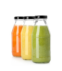 Bottles of fresh juices on white background