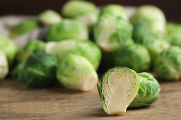 Fresh Brussels sprouts on wooden table, closeup