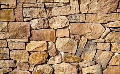 The wall is lined with large brown stones