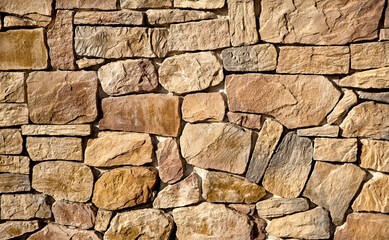 Fototapeta premium The wall is lined with large brown stones
