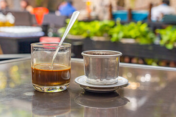 Vietnamese delicious condensed milk coffee brewed with drip filter