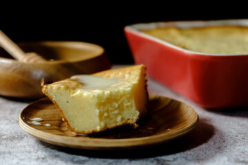 Slice of cottage cheese casserole with condensed milk