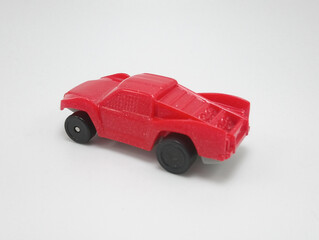 Small red plastic toy car